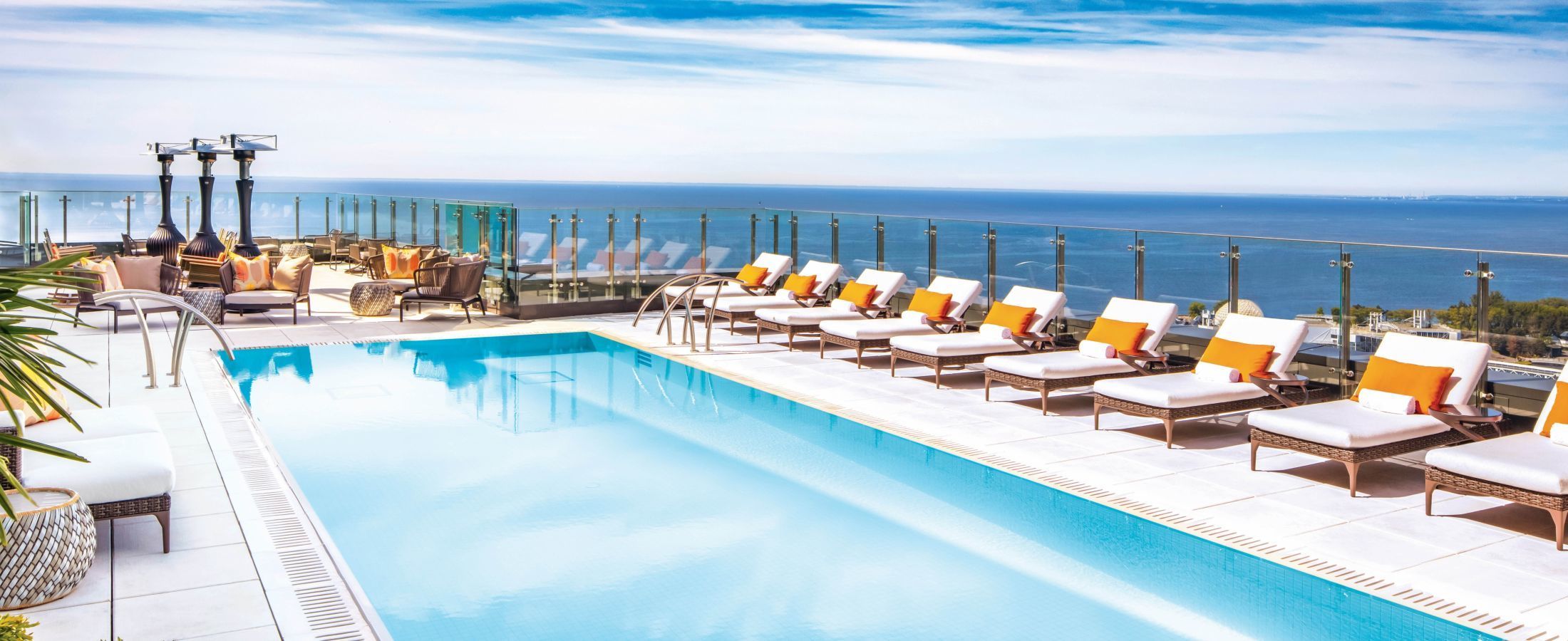 Rooftop Pool, the 'Pond', with poolside lounge chairs and views of Lake Ontario.